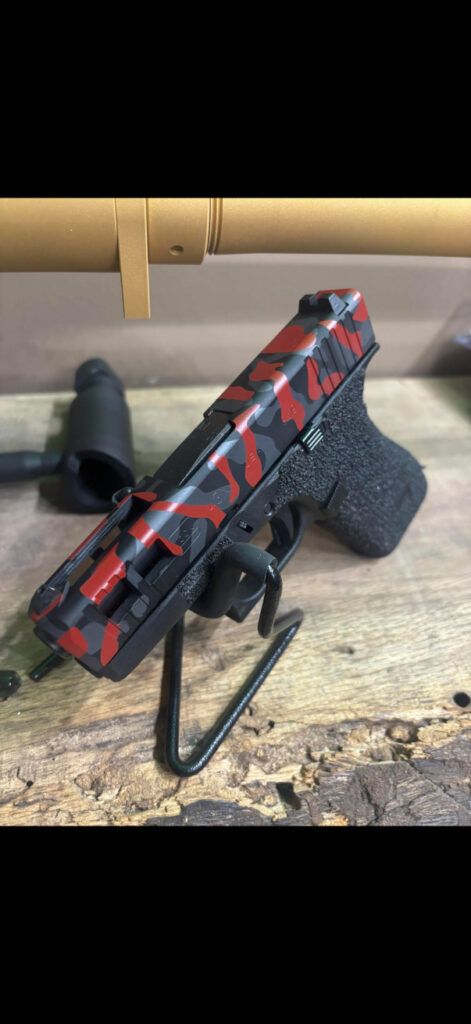 ABIS Arms custom red and charcoal camouflage finish on a pistol slide